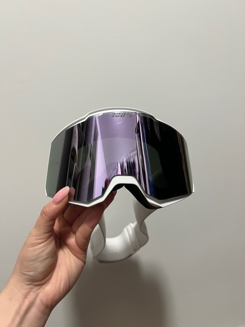 100% brand ski goggles with purple lens